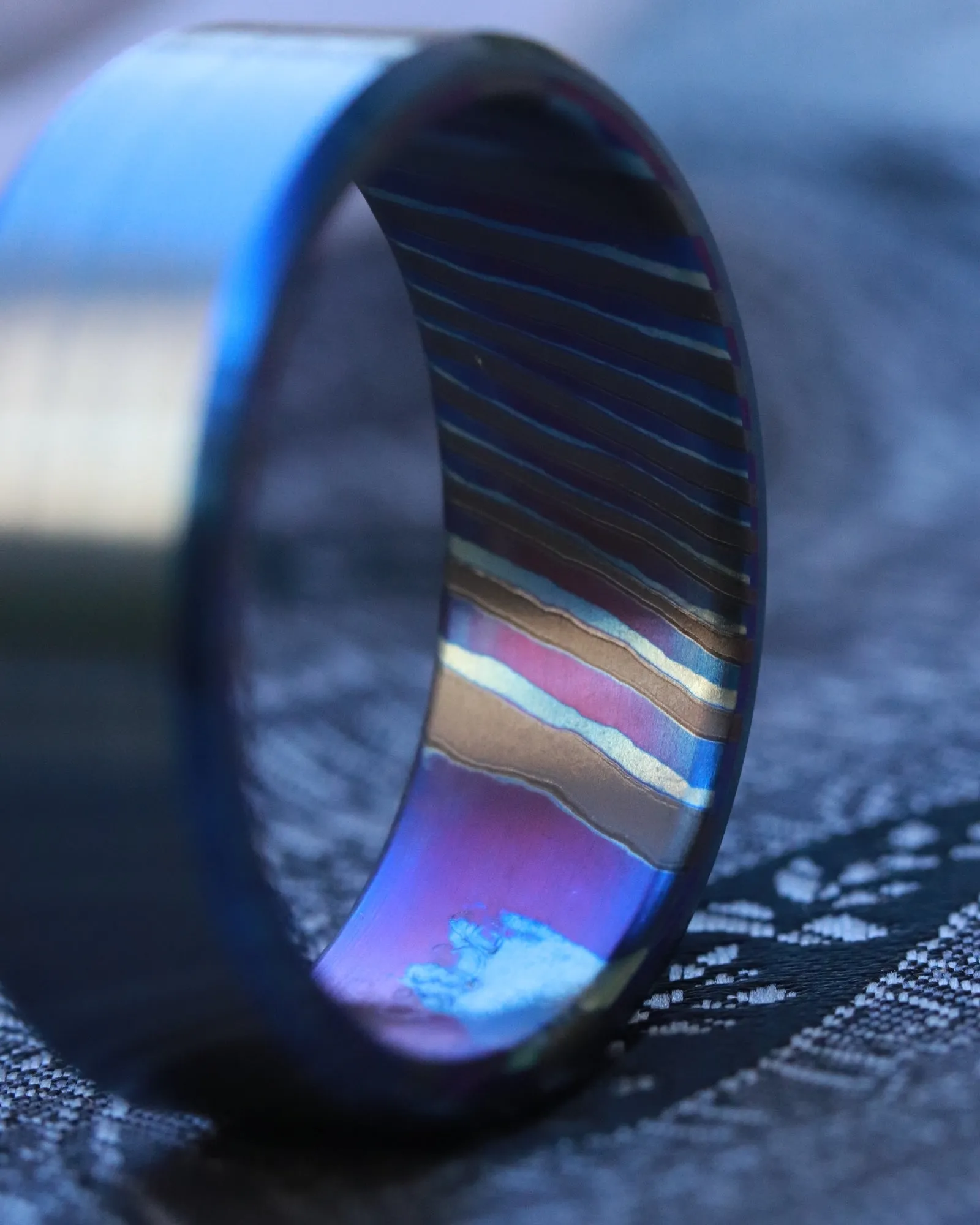 Matching set of two Black & blue titanium ZrTi band black titanium