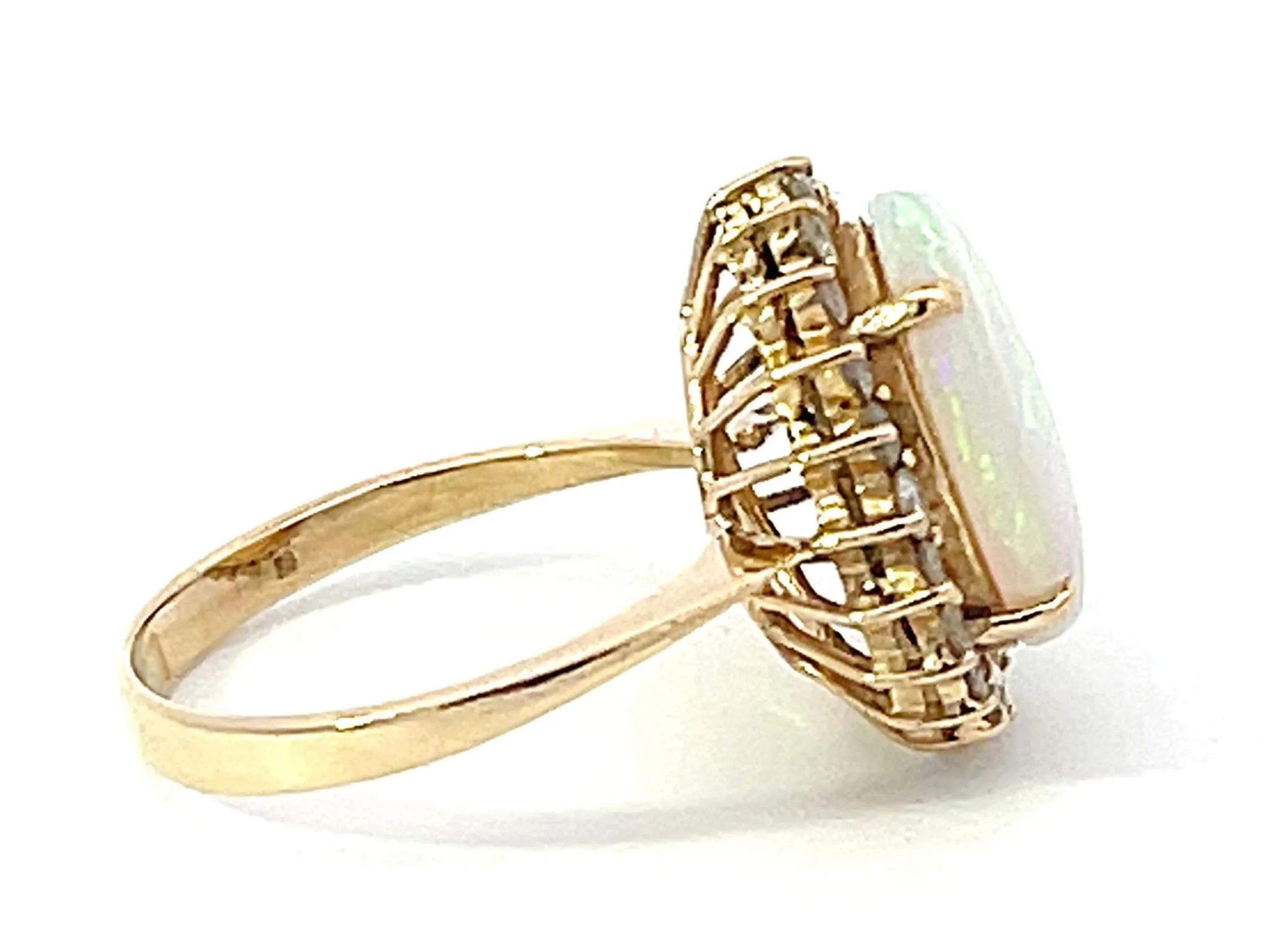 Opal and Diamond Halo Ring in 14k Yellow Gold