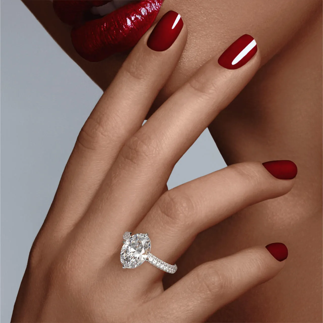 OVAL CUT DIAMOND ENGAGEMENT RING WITH A COMPASS 4 PRONG THREE PHASES TRIPLE PAVE SETTING IN PLATINUM