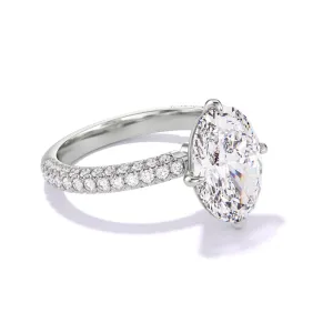OVAL CUT DIAMOND ENGAGEMENT RING WITH A COMPASS 4 PRONG THREE PHASES TRIPLE PAVE SETTING IN PLATINUM
