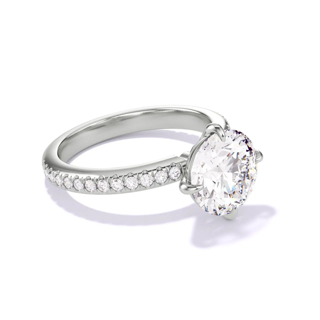 ROUND CUT DIAMOND ENGAGEMENT RING WITH A COMPASS 4 PRONG THREE PHASES PAVE SETTING IN PLATINUM